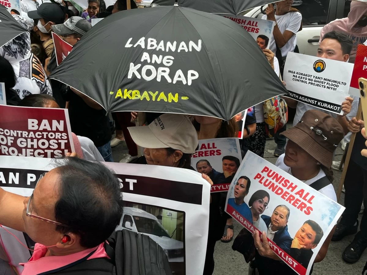 Several groups, including Akbayan and Youth Against Kurakot (YaK!), hold a peaceful creative protest outside the St. Gerrard Construction Building in Pasig City. (Photos from Akbayan Party)