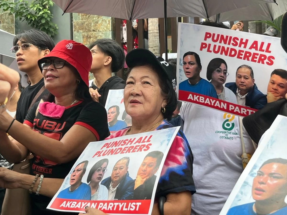 Several groups, including Akbayan and Youth Against Kurakot (YaK!), hold a peaceful creative protest outside the St. Gerrard Construction Building in Pasig City. (Photos from Akbayan Party)
