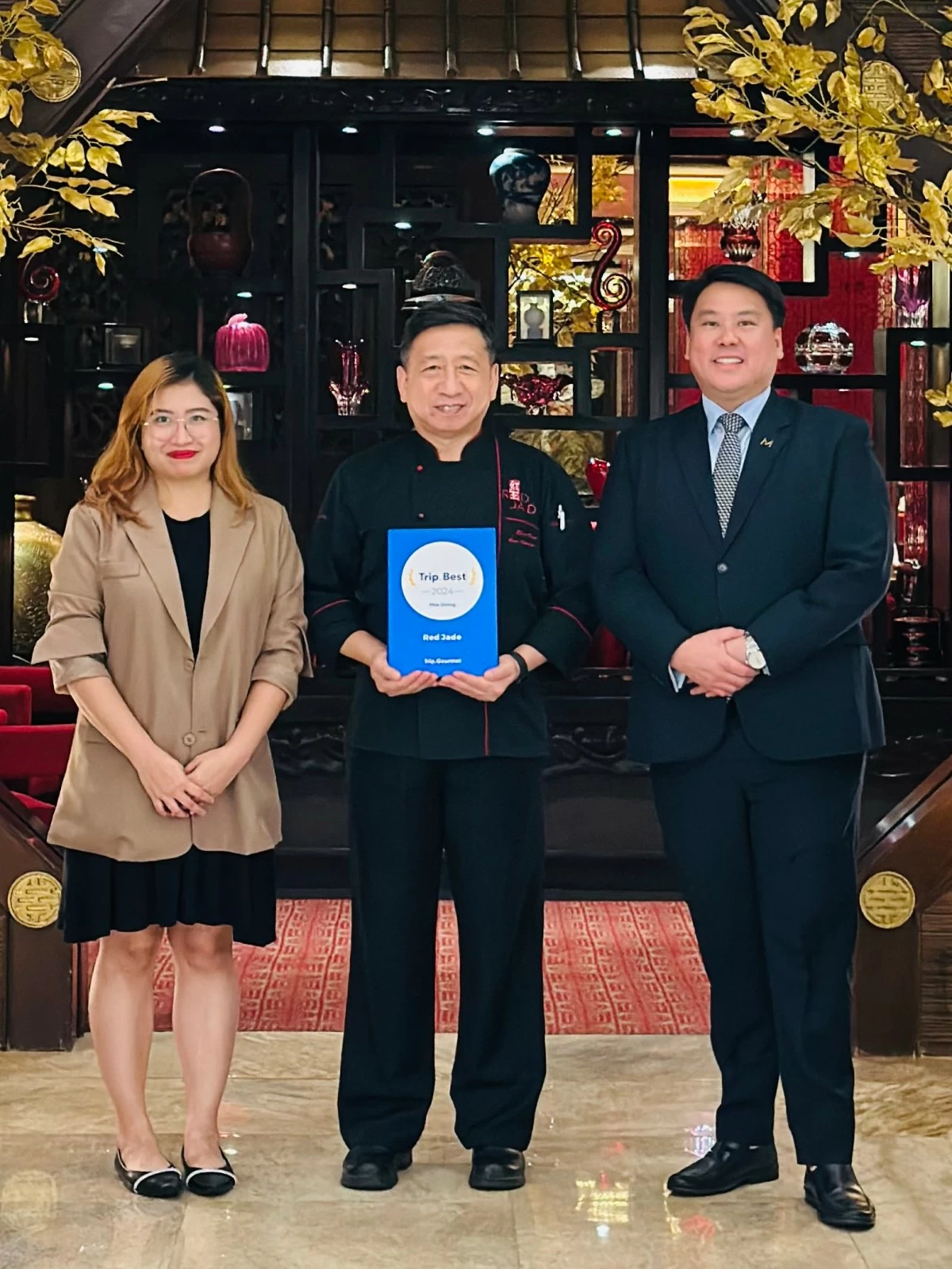 Rose Angelie Quilicol of Trip.com with Chef Sun Bing of Red Jade and Marvin Kim Tan of The Manila Hotel