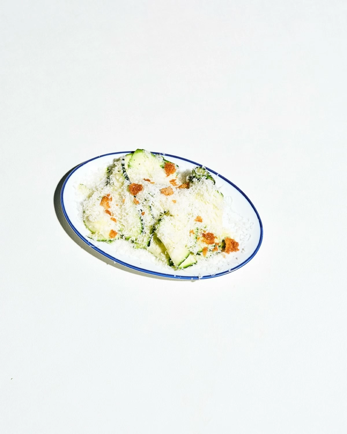 GREEN HARMONY A vibrant salad of zucchini and radicchio at Osteria, tossed in bright vinaigrettes and oils, then finished with Gorgonzola and Pecorino Romano.