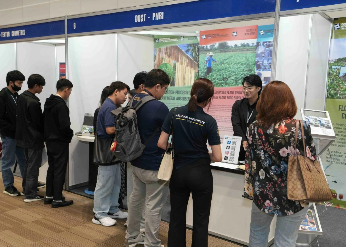 Expo visitors explore the DOST-PNRI booth at SUSTEX 2025, discovering innovations in nuclear science and technology for sustainable development.
