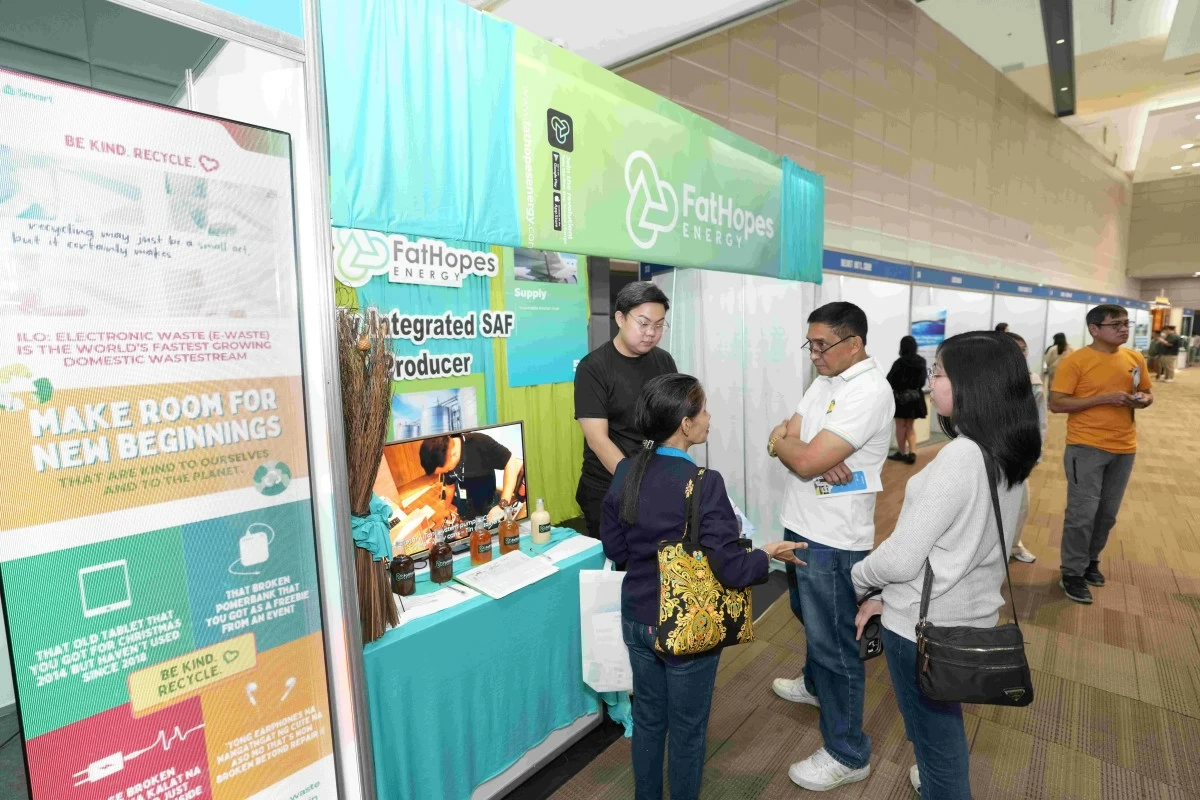 SUSTEX 2025 visitors engage with the FatHopes Energy booth, learning about innovative solutions for converting used cooking oil into sustainable biofuels.