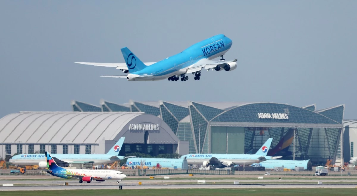 A Korean Air chartered plane takes off to bring back Korean workers detained in an immigration raid in Georgia, at Incheon International Airport, South Korea, Wednesday, Sept. 10, 2025. (Yonhap via AP)