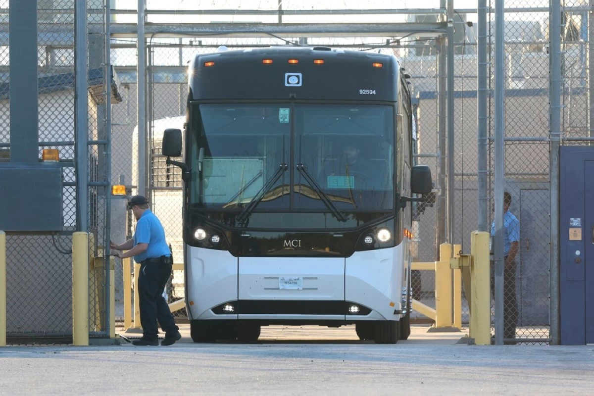A bus leave the Folkston Immigration and Customs Enforcement processing center, Wednesday, Sept. 10, 2025, in Folkston, Ga. (AP Photo/Gary McCullough)