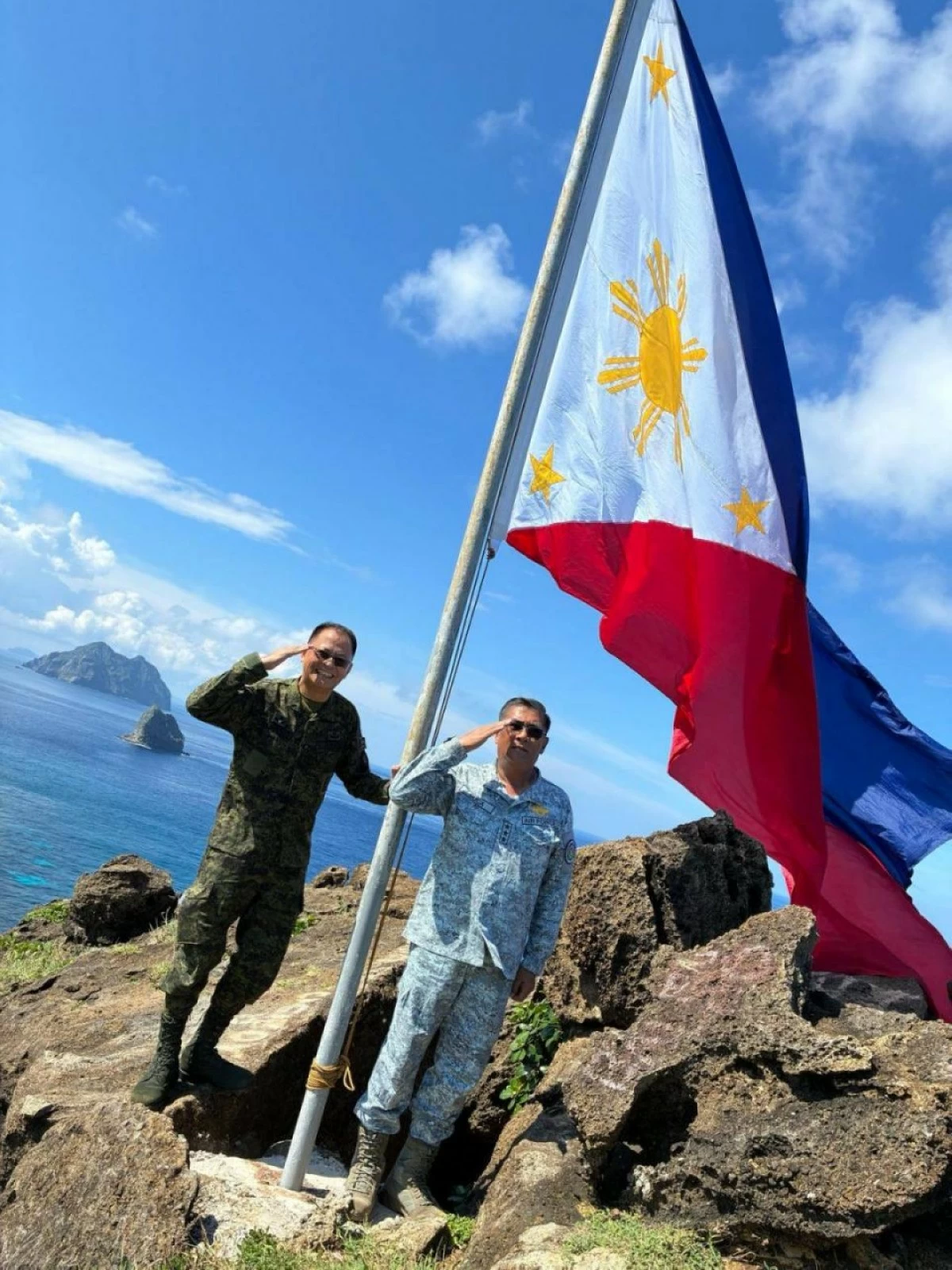 Army Chief Lt. Gen. Antonio G. Nafarrete and AFP's Northern Luzon Command (Nolcom) Commander Lt. Gen. Fernyl G. Buca salute the Philippine flag during their visit to the Naval Detachment on Mavulis Island in Batanes on September 10, 2025.⁩ (photo: Philippine Army)