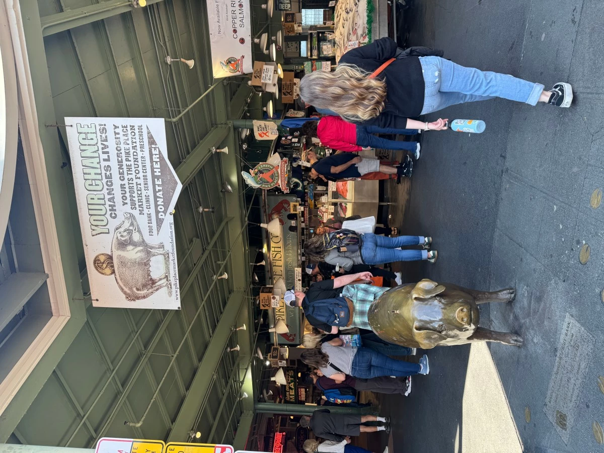 SUPPORT THE MARKET This bronze pig statue at Pike Place Market serves as a donation piggy bank with proceeds supporting social services