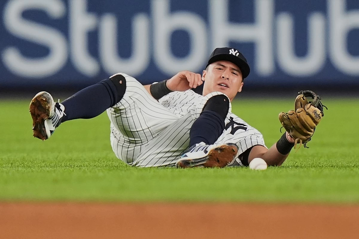 New York Yankees' Anthony Volpe reacts after a ball hit by Detroit Tigers' Trey Sweeney gets past him for an RBI single during the seventh inning of a baseball game Tuesday, Sept. 9, 2025, in New York. (AP Photo/Frank Franklin II)