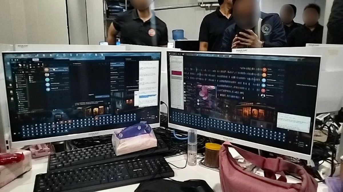CIDG operatives raid an online scam hub in Barangay Tambo, Parañaque City where a female Chinese and 13 Filipinos were arrested. (photo: CIDG()
