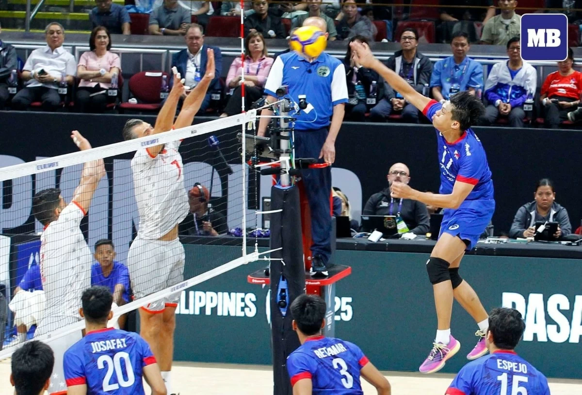 Leo Ordiales hammers it down against the Tunisian defense in the opening game of the FIVB Men's World Championship Friday night, Sept. 12. (Mark Balmores/MB)