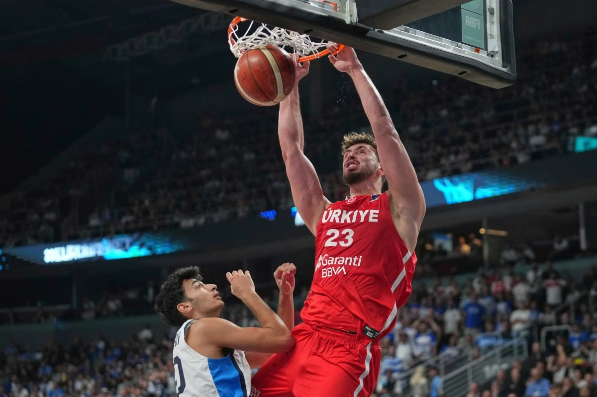 Turkey's Alperen Sengun scores during the Eurobasket, European Basketball Championship semi-final match between Greece and Turkey at the Riga Arena in Riga, Latvia, Friday, Sept. 12, 2025. (AP Photo/Sergei Grits)