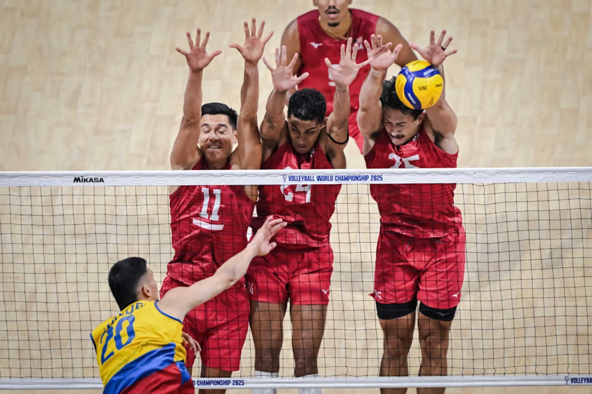 Team USA makes a triple block in its match against Colombia. (Volleyball World)