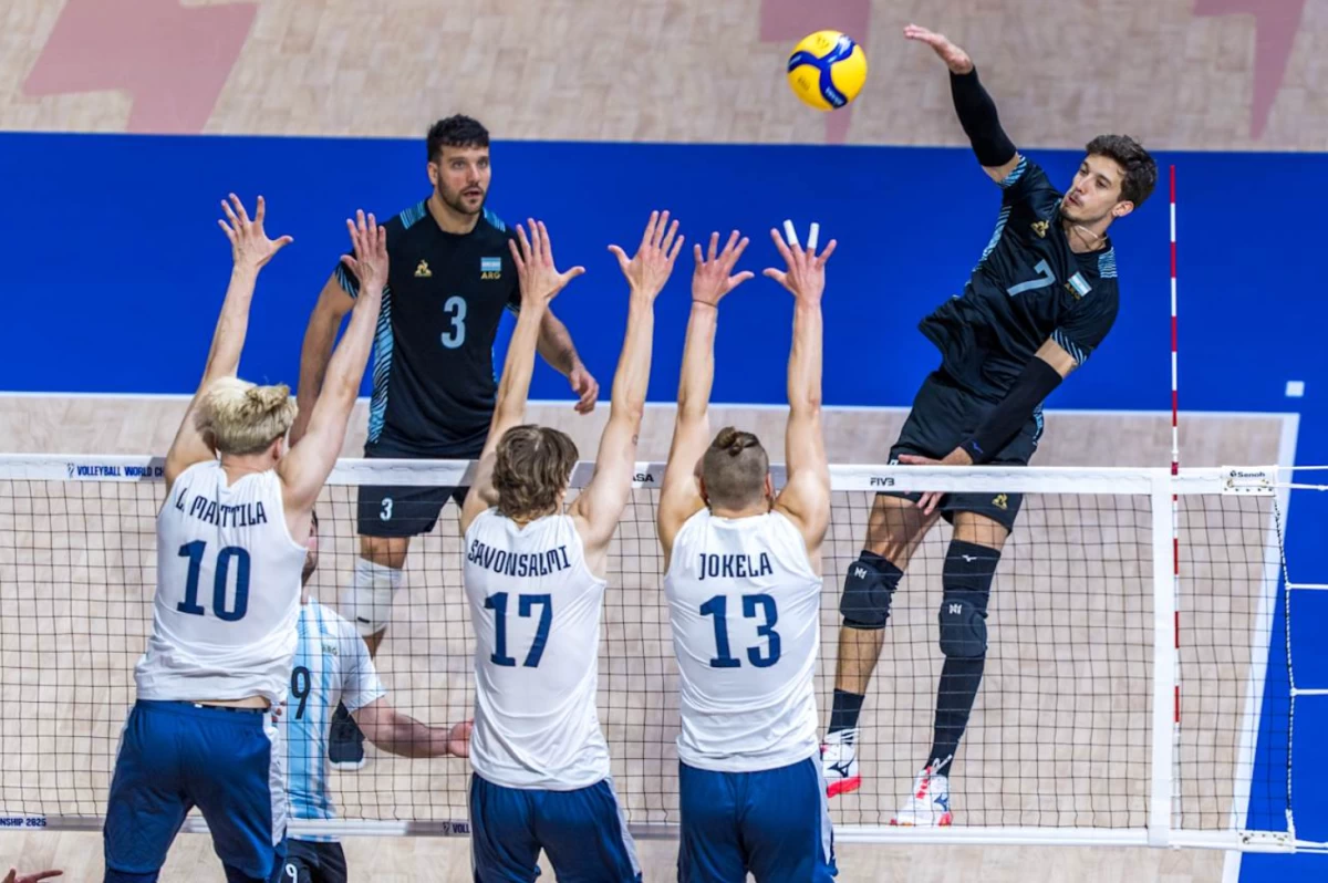 LUCIANO PALONSKY scores for Argentina against three defenders from Finland during their FIVB Volleyball Men's World Championship match. (Volleyball World)