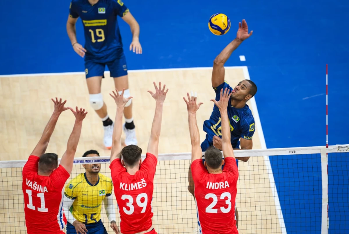Brazil's RICARDO LUCARELLI scores against three Czechia defenders. (Volleyball World)