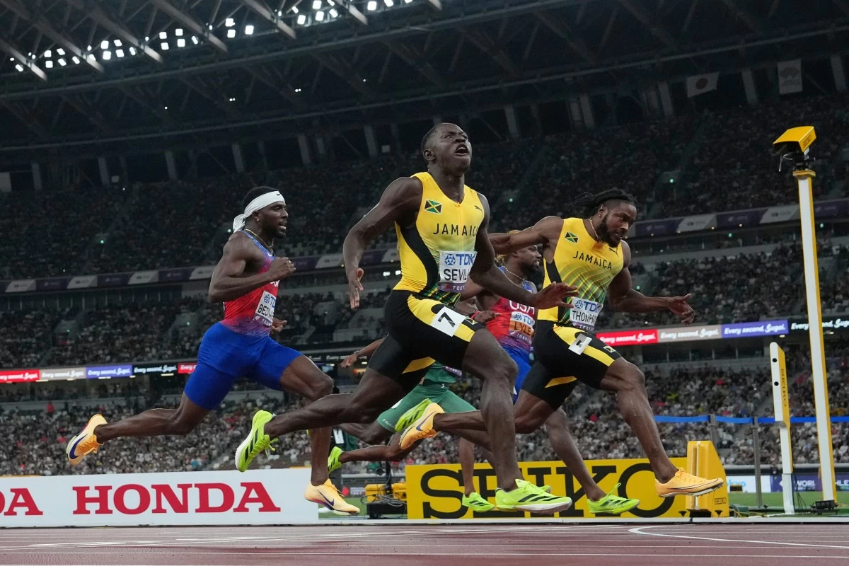 Jamaica's Oblique Seville (7) wins the men's 100 meters final at the World Athletics Championships in Tokyo, Sunday, Sept. 14, 2025. (AP Photo/David J. Phillip)