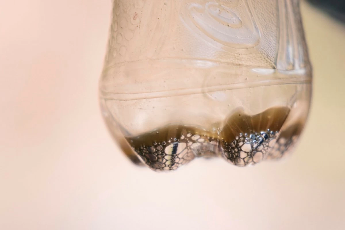 A sample of mercury is displayed in a Coca-Cola bottle in San Joaquin, Mexico, Tuesday, Aug. 19, 2025. (AP Photo/Fernando Llano)