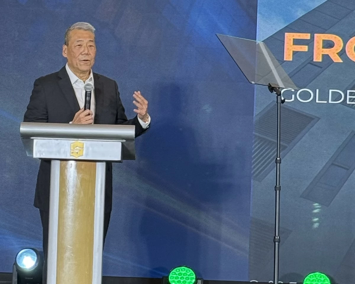 Bernie Liu speaking at the podium