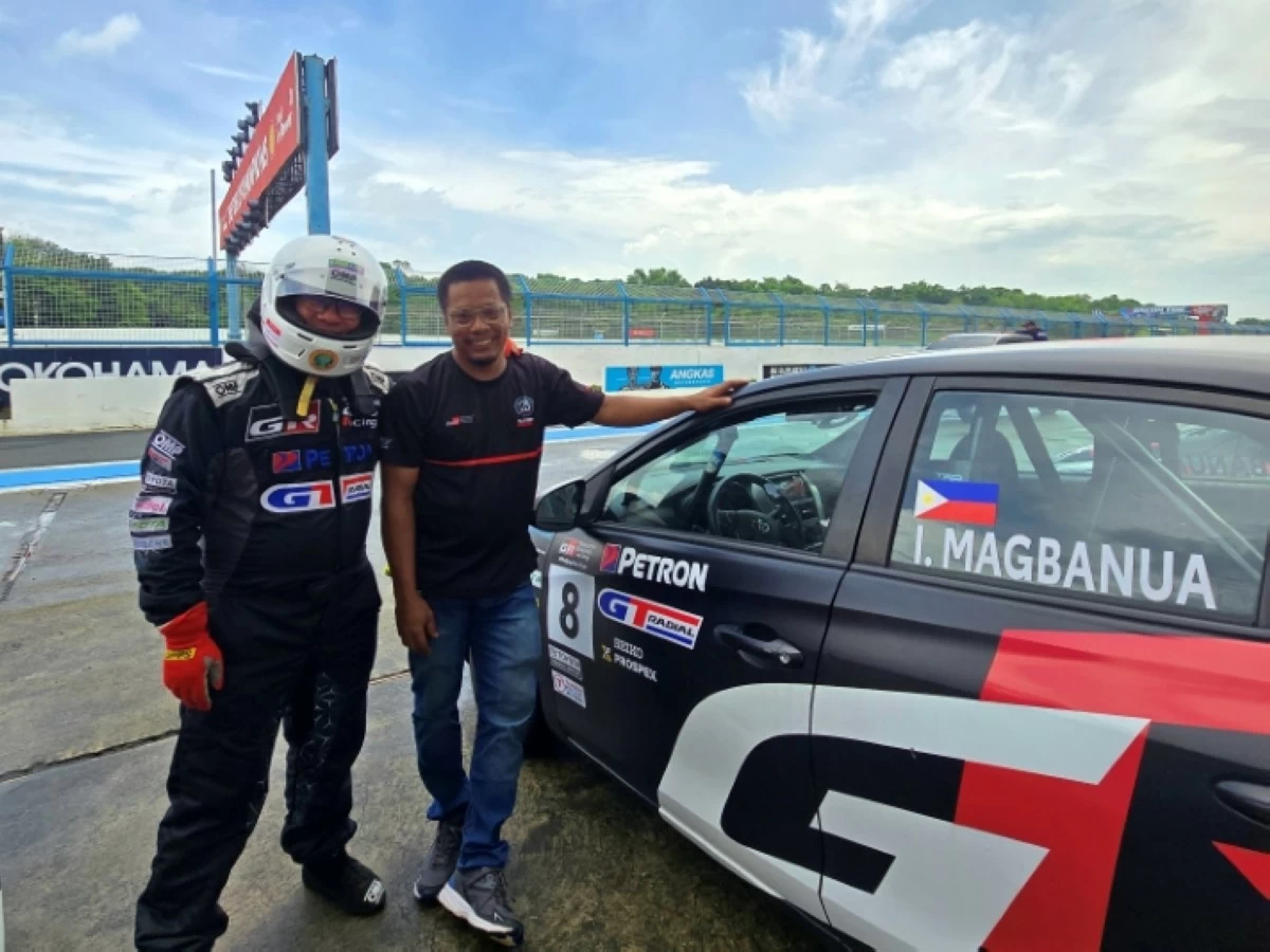 With my ever-reliable mechanic, Baldo. Throughout the season, he helped me learn how to drive within the limits of the car, but was always on hand to help with any car-related issues I was having.