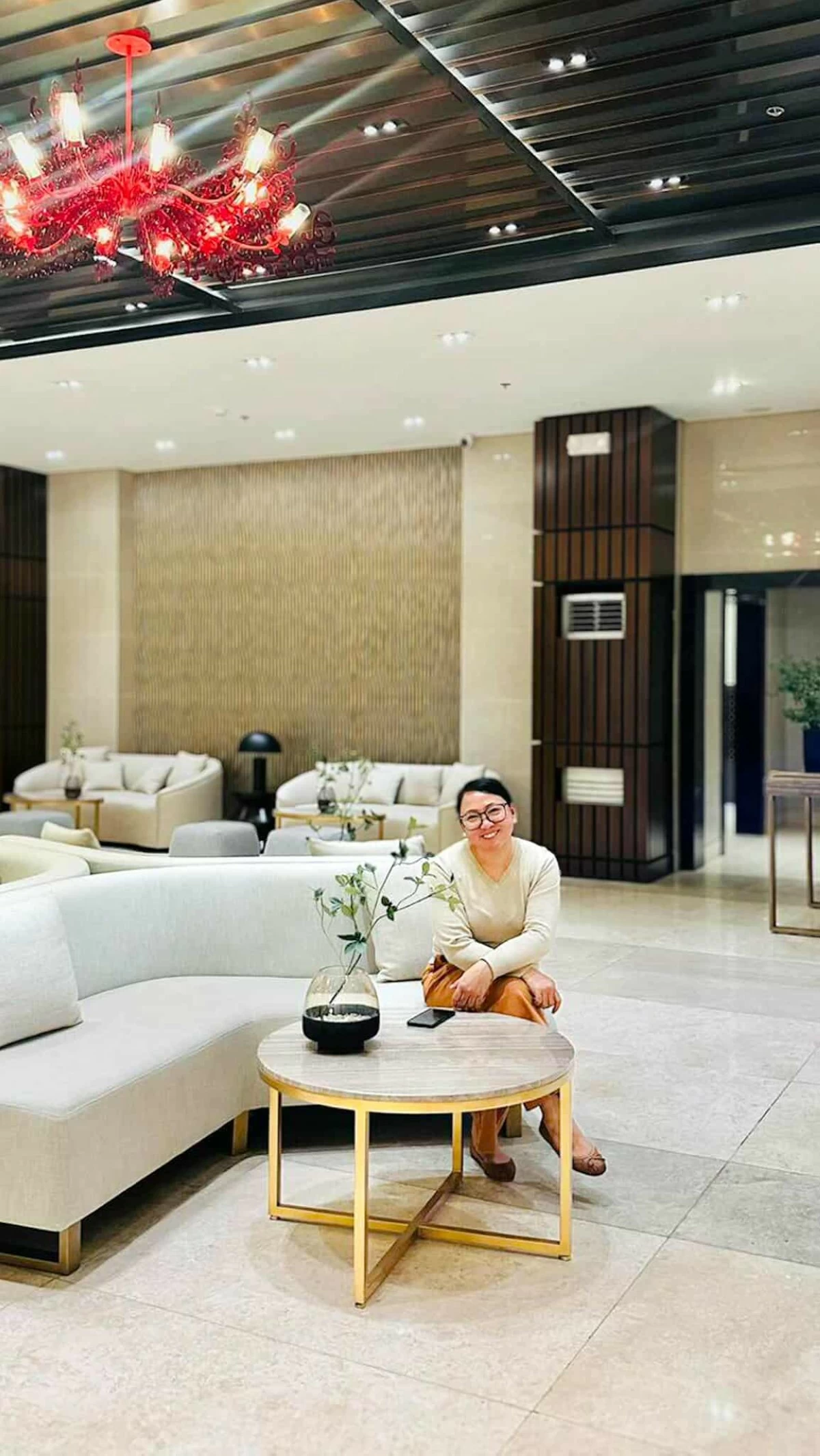 Relaxed and at home: Arch. Pam de Guzman spends time at the Red Residences lounge, one of her favorite community spaces.