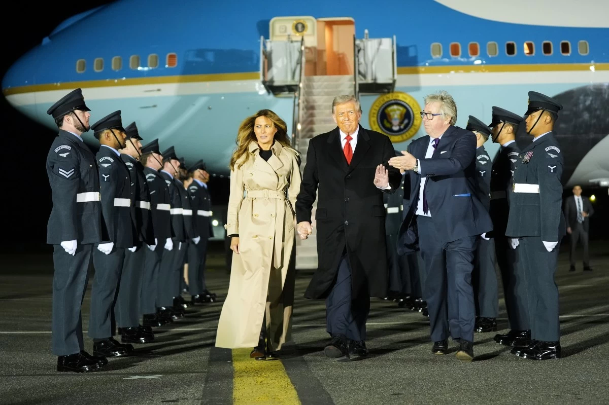 President Donald Trump and first lady Melania Trump are greeted by The Viscount Hood, Lord-in-Waiting, center, right, as they arrive at Stansted Airport near London, Tuesday, Sept. 16, 2025. (AP Photo/Evan Vucci)