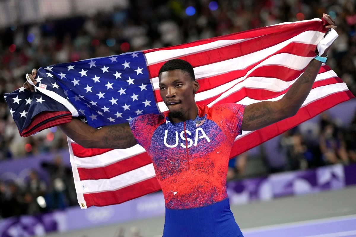 FILE - Fred Kerley, of the United States, celebrates after his third place finish in the men&#039;s 100-meter final at the 2024 Summer Olympics, on Aug. 4, 2024, in Saint-Denis, France. (AP Photo/Bernat Armangue, File)