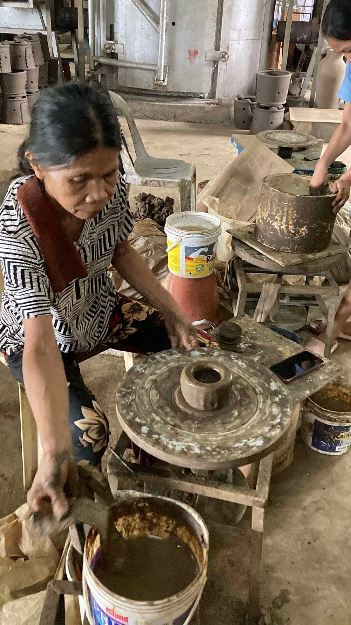 MOLDED INTO LIFE A potter shows their handiwork when it comes to making the pot.