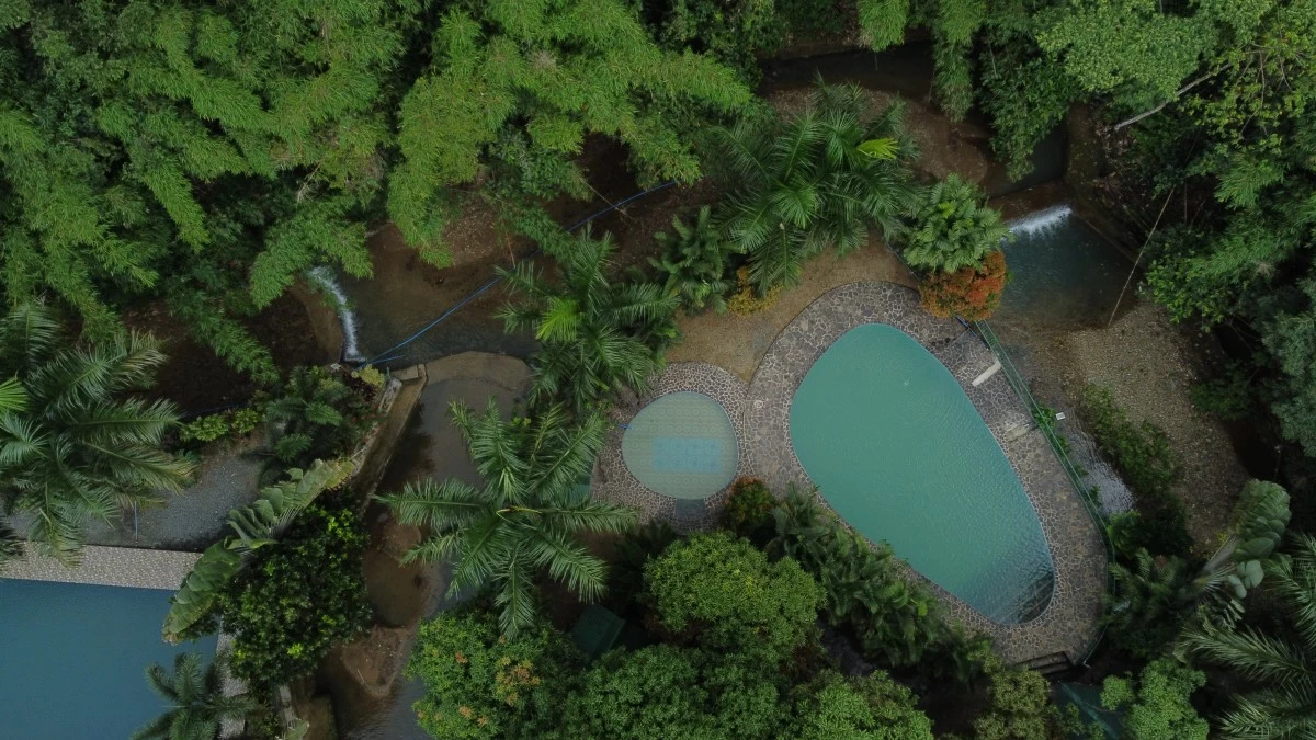 A swimming pool resort in the Upper Marikina Watershed diverts Check Dams built after Ondoy