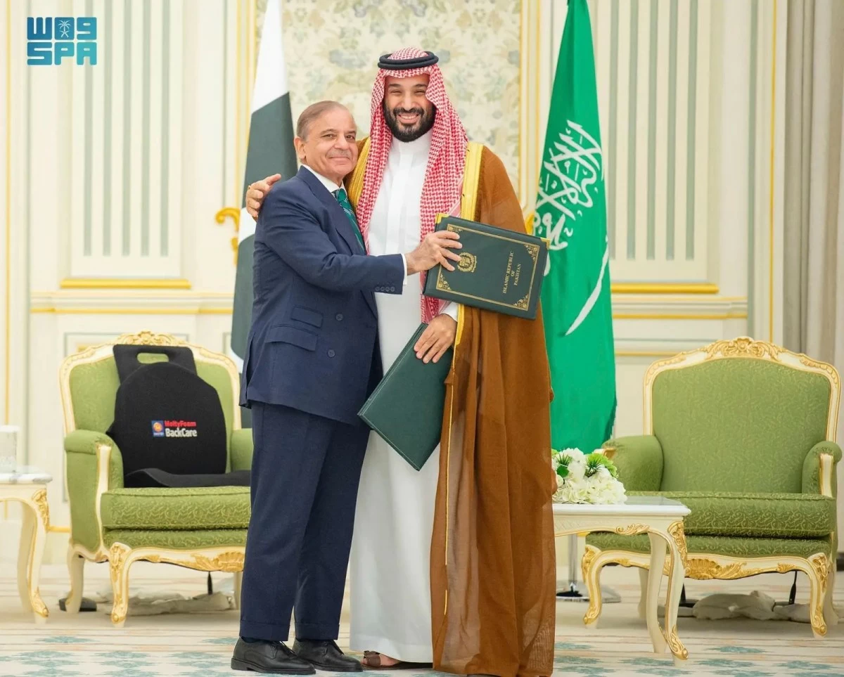 This handout photograph released by the state-run Saudi Press Agency shows Pakistani Prime Minister Shehbaz Sharif, left, embracing Saudi Arabia's Crown Prince Mohammed bin Salman after signing a joint defense pact in Riyadh, Saudi Arabia, Wednesday, Sept. 17, 2025. (Saudi Press Agency via AP)