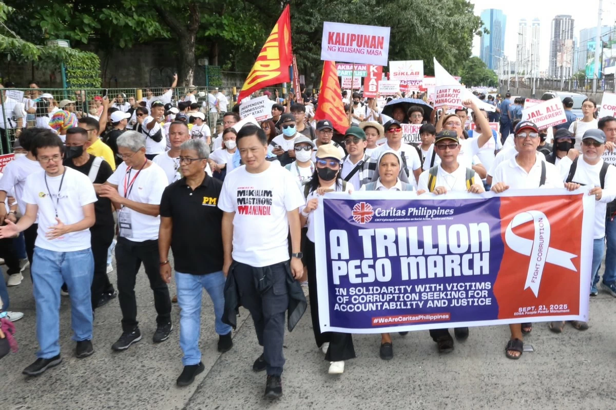 Thousands of protesters march towards the EDSA People Power Monument in Quezon City on Sunday, September 21, 2025 to call on the government to prosecute corrupt government officials and contractors involved in anomalous and ghost flood control projects in the country. (Santi San Juan)