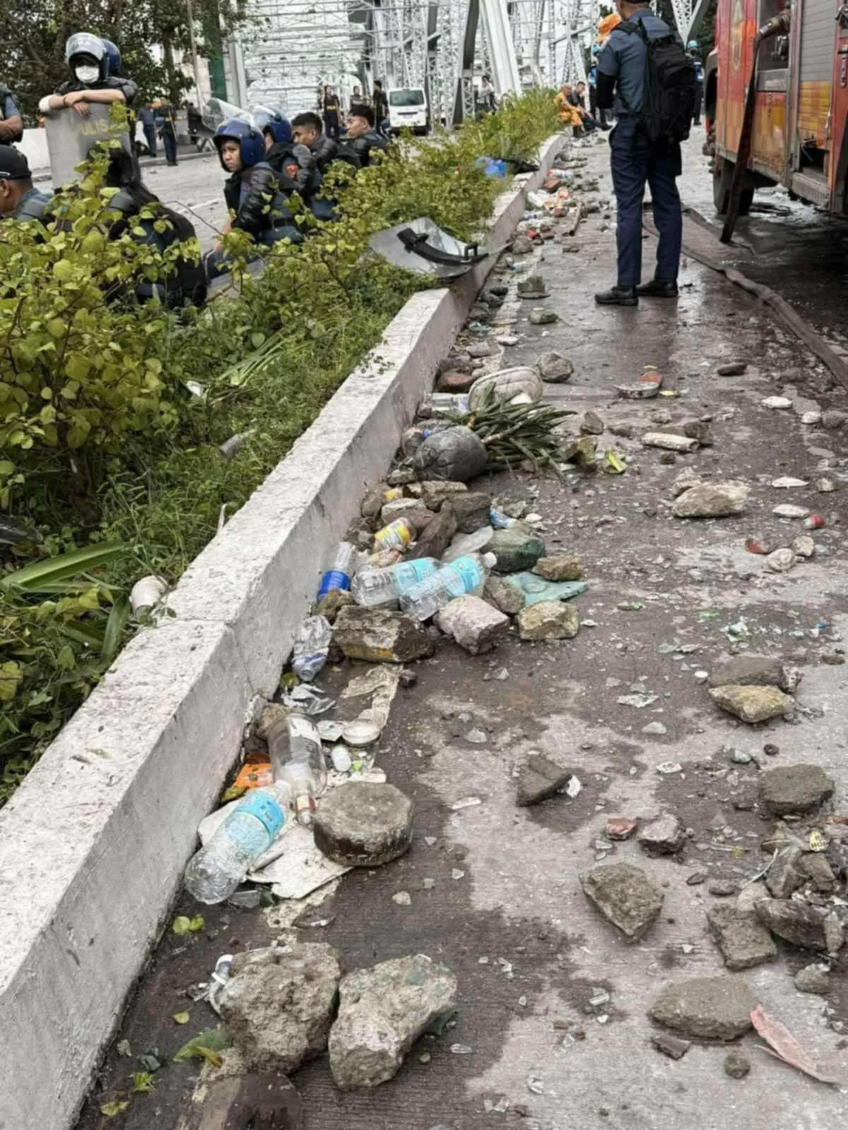 Manila DRRMO and Manila DPS conduct clearing operations to remove debris following a clash between protesters and authorities on Ayala Bridge in Manila on Sept. 21. (Photos from Mayor Isko Moreno Domagoso)