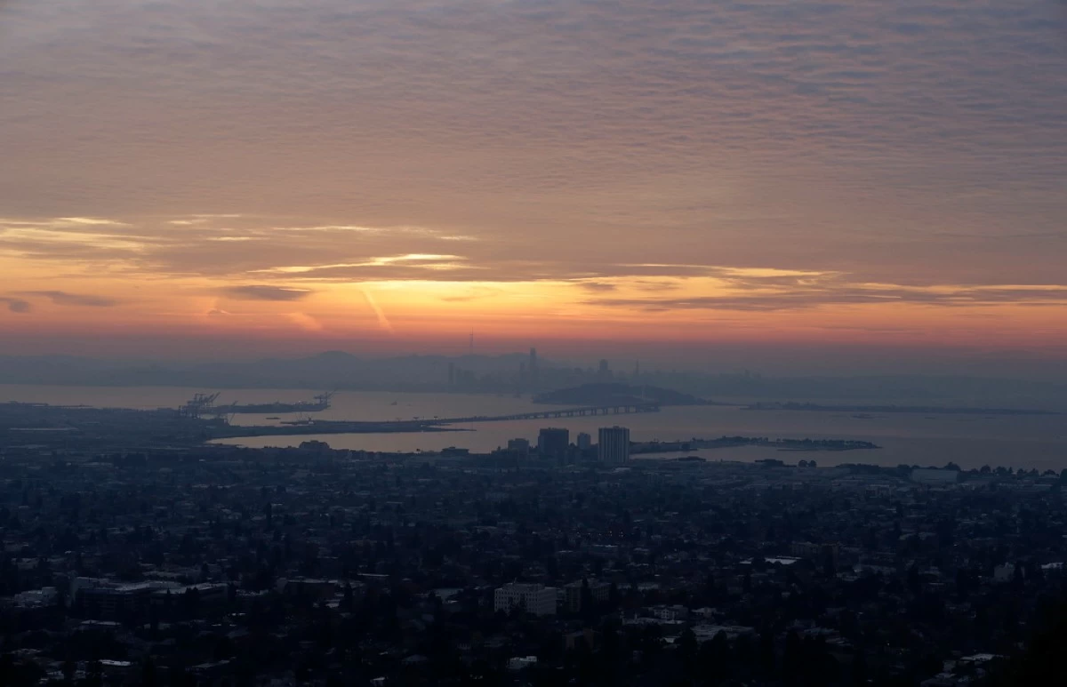 FILE - The San Francisco skyline and the eastern span of the Bay Bridge are shown from Berkeley, Calif., Dec. 22, 2017. (AP Photo/Jeff Chiu, file)