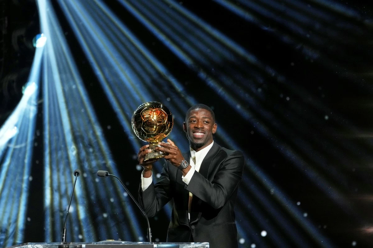 Paris Saint-Germain's Ousmane Dembélé receives the 2025 Men's Ballon d'Or during the 69th Ballon d'Or awards ceremony at the Theatre du Chatelet in Paris, Monday, Sept. 22, 2025. (AP Photo/Thibault Camus)