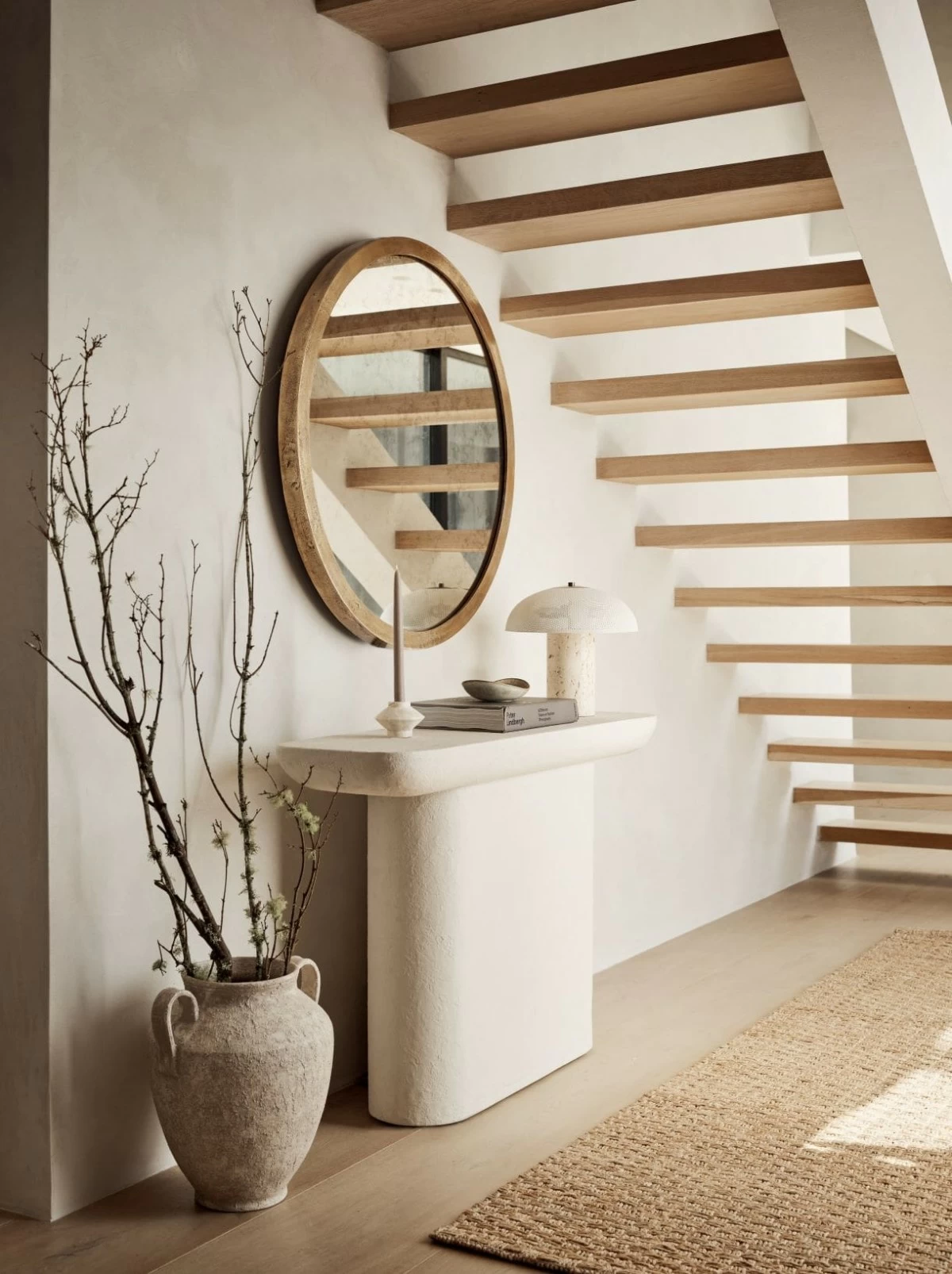 Quarry graces living rooms or entryways with understated elegance. A study in curves and simple geometry, the perfectly proportioned console table balances a rounded rectangular top with a reverse half-bullnose edge on a racetrack base.
