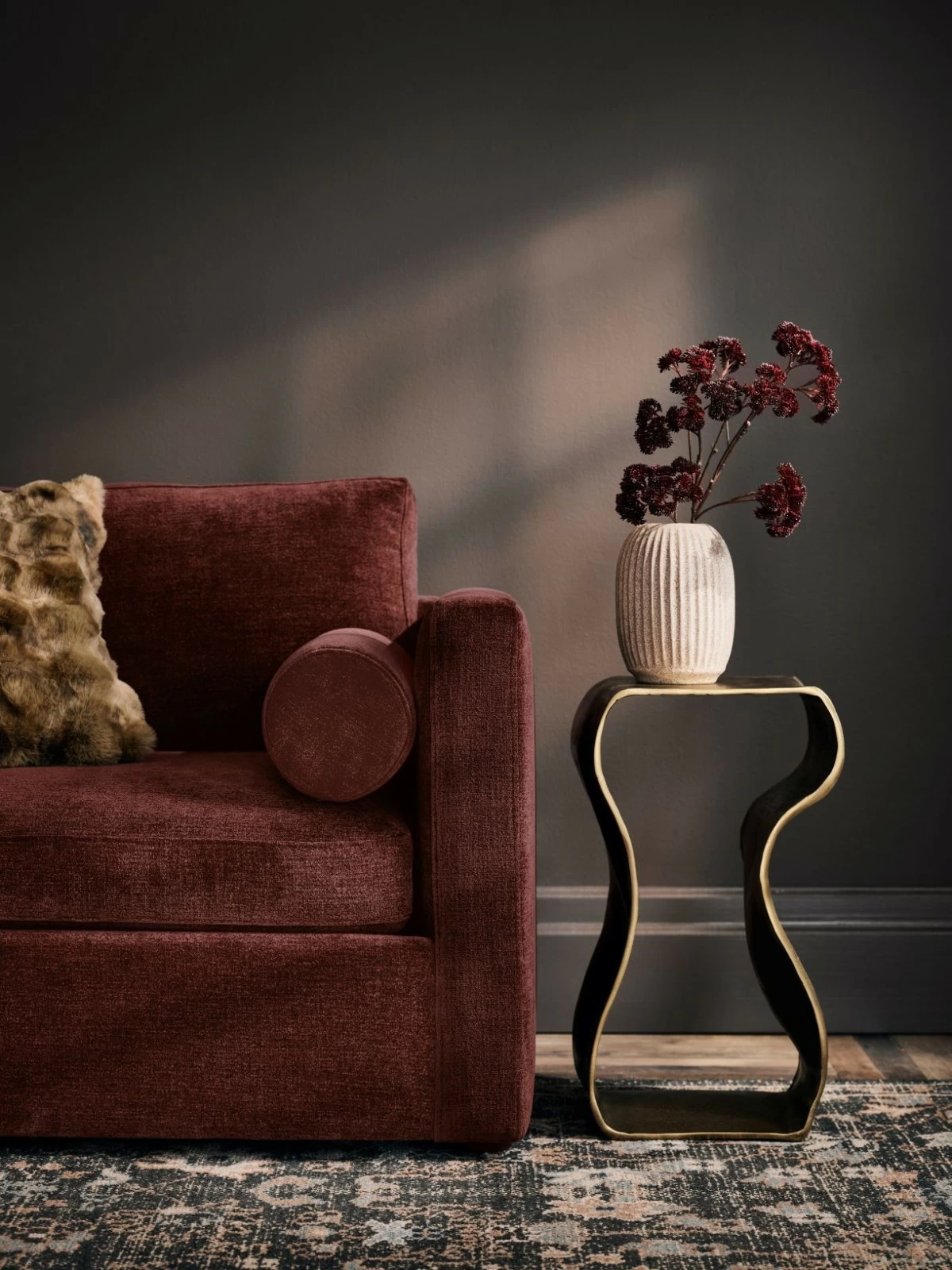 This eye-catching accent table tucks next to a sofa as a handy surface to set down a glass while also adding a dash of movement and artistic flair to the entire room.
