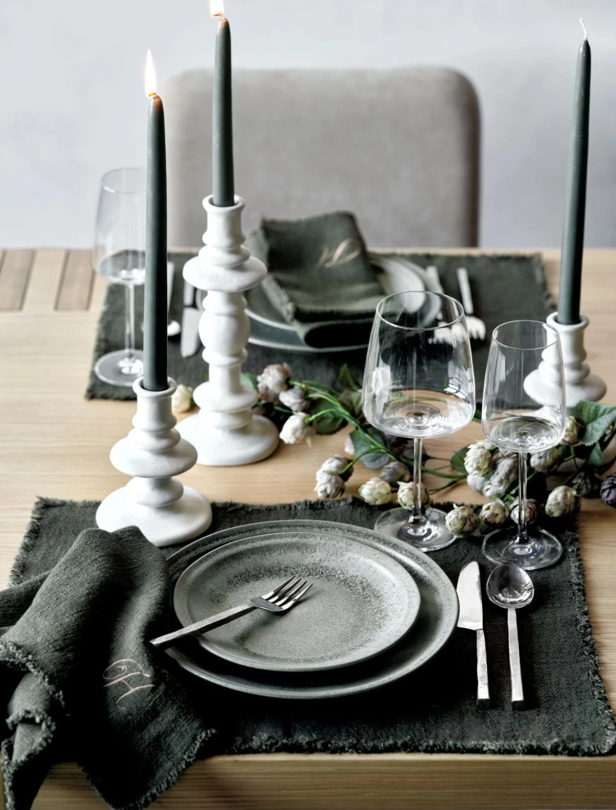 Reactive glaze and organic shapes give our Prairie dinnerware collection its straight-from-the-ceramics-studio appeal. Formed with coupe contours, the collection provides generous surface area to show off the glaze's capricious nature, making each piece a masterpiece in mossy green or earthy cream tones.

Reminiscent of cairns, the Cortana candle holder stacks organic forms in an ornate, sinuous silhouette. Reactive cream glaze coats the earthenware, giving the candlestick a warm, subtly speckled finish. The effect is casual and effortlessly elegant to suit modern dining tables.

