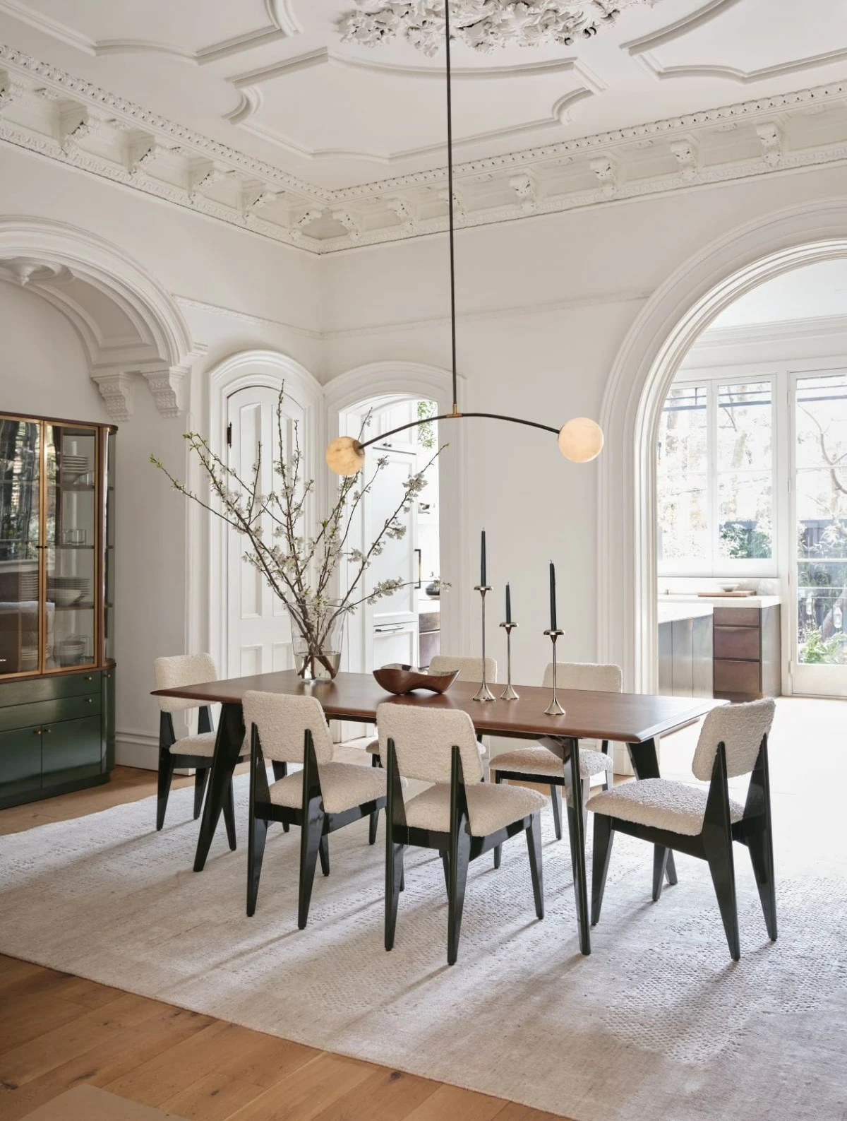 Verbier channels the best of classic French midcentury design. The dining table takes an angled stance on tapered legs with a gently tapered silhouette and an understated-yet-vibrant dark green finish glossed with high-sheen lacquer.
