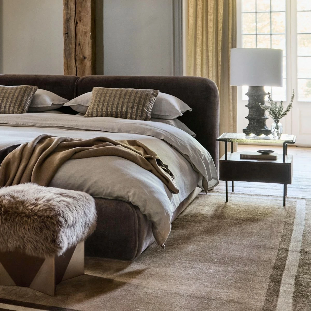 Our Curios bed speaks pure comfort with cozy upholstery and low profile. Inspired by 1970s design, the bed looks contemporary yet approachable with a rounded, well-cushioned headboard and rails upholstered in soft chenille. Part of the Collected Home Collection in collaboration with Jeremiah Brent.
