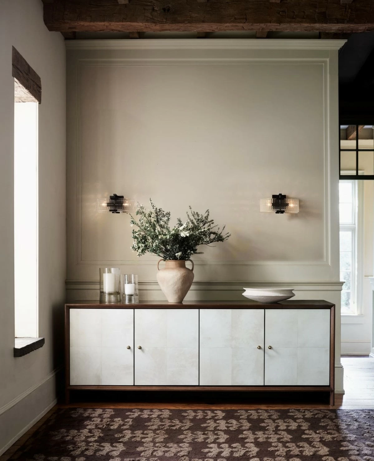 Introducing The Collected Home. Our exclusive new collaboration with interior designer Jeremiah Brent is rich with bespoke details and bold individuality. A collector's item in the making, Parchemin is an ode to heirloom materials and the glamour of 1940s design. This sleek, sophisticated credenza offers generous storage with one adjustable shelf per cabinet.
