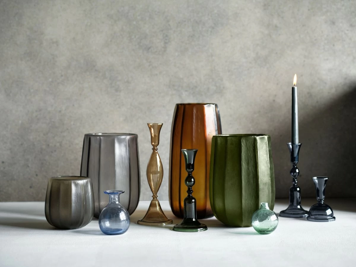 Our Renata vases practically glow from within. Skilled artisans etch the fluted glass by hand to create a matte frosted finish that reminds us of seaglass. The dark green hue fascinates with deep blue undertones and a touch of soft grey.