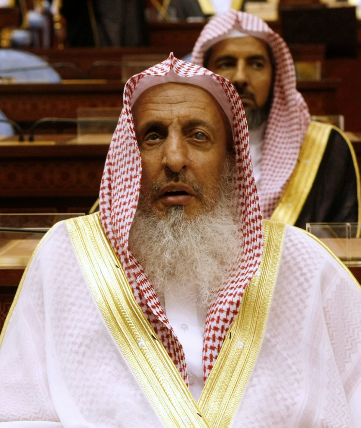 FILE - Sheikh Abdulaziz al-Sheikh, the Saudi grand mufti, listens to a speech of King Abdullah of Saudi Arabia at the Consultative Council in Riyadh, Saudi Arabia, March 24, 2009. (AP Photo/Hassan Ammar, File)