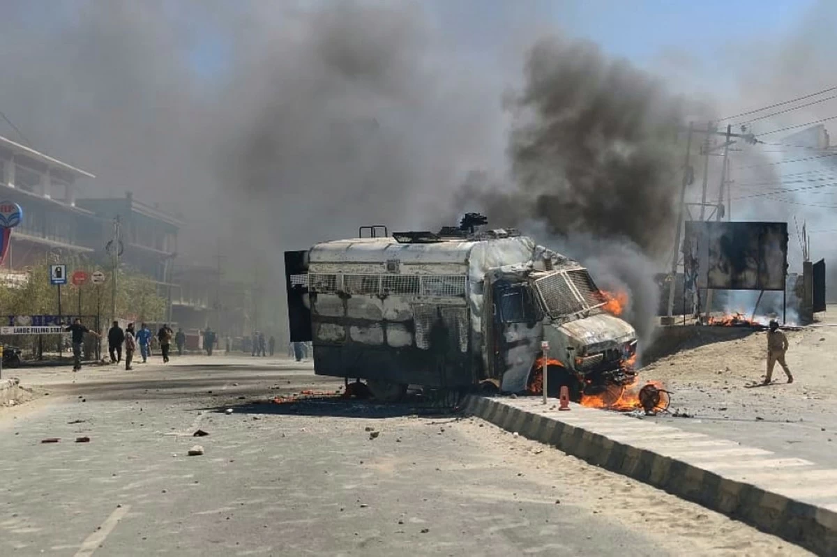A police vehicle is set on fire during a protest by locals demanding federal statehood from the Indian government, in the high-altitude Leh town, in the region of Ladakh, India, Wednesday, Sept. 24, 2025. (AP Photo)
