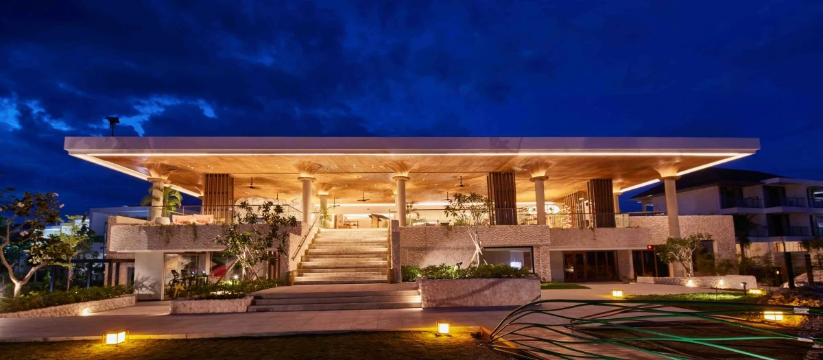 ISLAND ELEGANCE The main building of the resort blends modern design with a coastal setting, welcoming guests with both style and warmth.