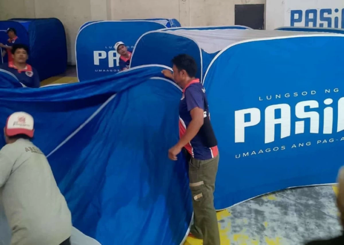 The local government of Pasig sets up tents and equipment at evacuation sites in preparation for severe tropical storm 