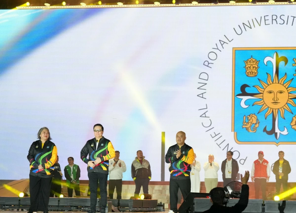 Rev. Fr. Richard G. Ang, O.P., Rector of the University of Santo Tomas (middle); Asst. Prof. Gilda Ma. Paz Kamus, Institute of Physical Education and Athletics Assistant Director;  and Rev. Fr. Rodel S. Cansancio, O.P., Director/ Regent of the Institute of Physical Education and Athletics are being presented during the UAAP Season 88 Opening Ceremonies