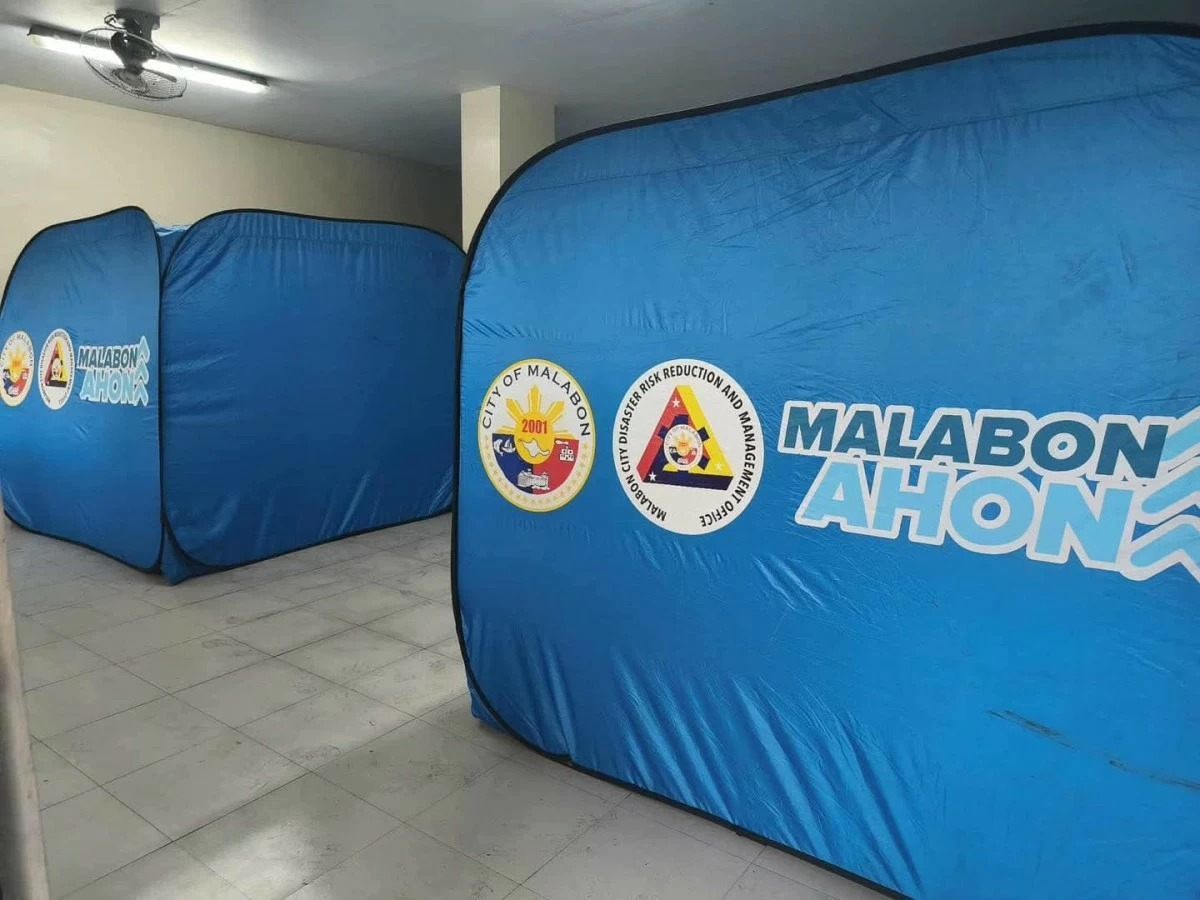 The Malabon City government prepares tents at an evacuation center on Friday, Sept. 26, in anticipation of residents who may be displaced by Typhoon “Opong.” (Photo from Malabon LGU)