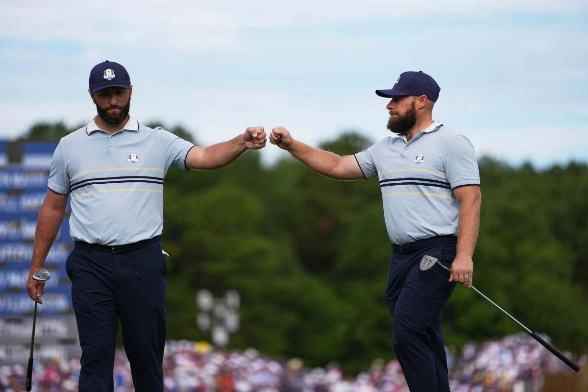 Europe's Jon Rahm and Tyrrell Hatton celebrate on the 11th hole at Bethpage Black golf course during the Ryder Cup golf tournament, Friday, Sept. 26, 2025, in Farmingdale, N.Y. (AP Photo/Matt Slocum)