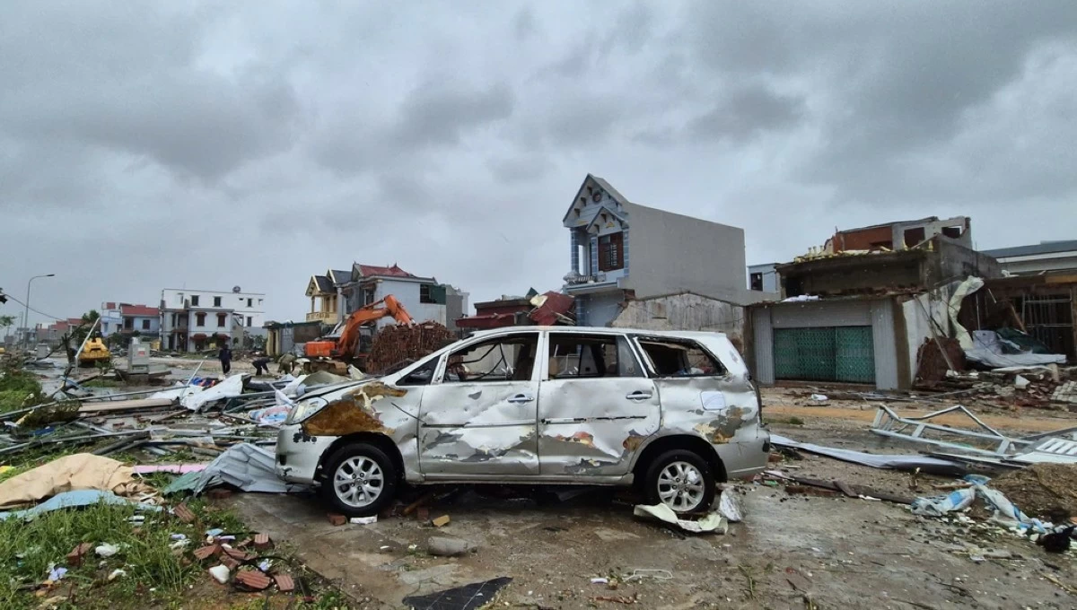 A damaged car is seen amid debris and other damaged buildings after Typhoon Bualoi swept through Thanh Hoa, Vietnam, Monday, Sept. 29, 2025. (Viet Hoang/VNExpress via AP)