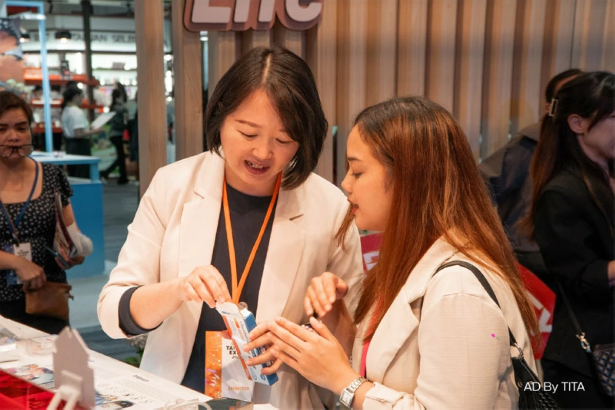 Mandy Lee (left), regional manager of Apex Bio, introduces the Eclipse Plus Multi-Purpose Analyzer, designed to help families take charge of their health through preventive monitoring.