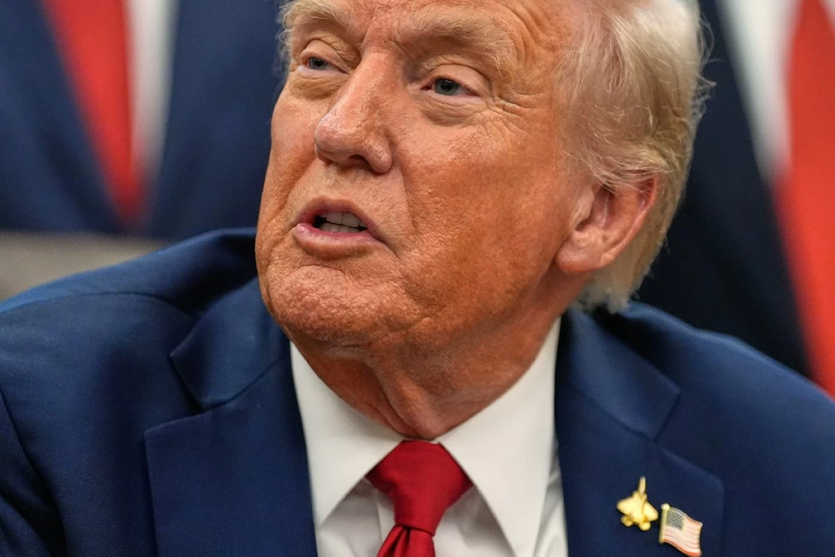 President Donald Trump speaks in the Oval Office of the White House before signing an executive order regarding childhood cancer and the use of AI, Tuesday, Sept. 30, 2025, in Washington. (AP Photo/Alex Brandon)