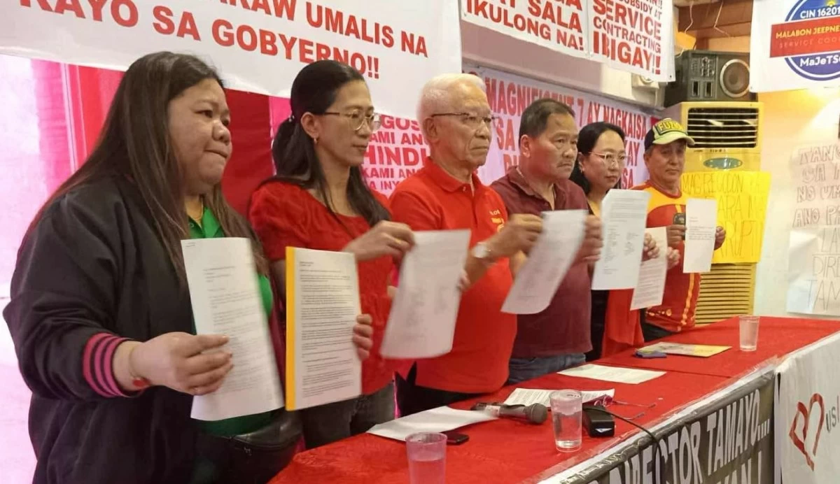 The heads of major transport groups show the letter they sent to President Marcos that discusses their disappointment and impatience over slow progress of the Public Transport Modernization Program (PTMP) during a press conference in Quezon City on October 2, 2025. 