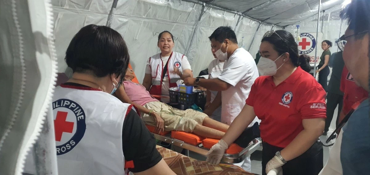 Nurses, doctors, and volunteers are working tirelessly as the PRC medical tent in Bogo treats patients needing critical stabilization. (Photo from PH Red Cross)